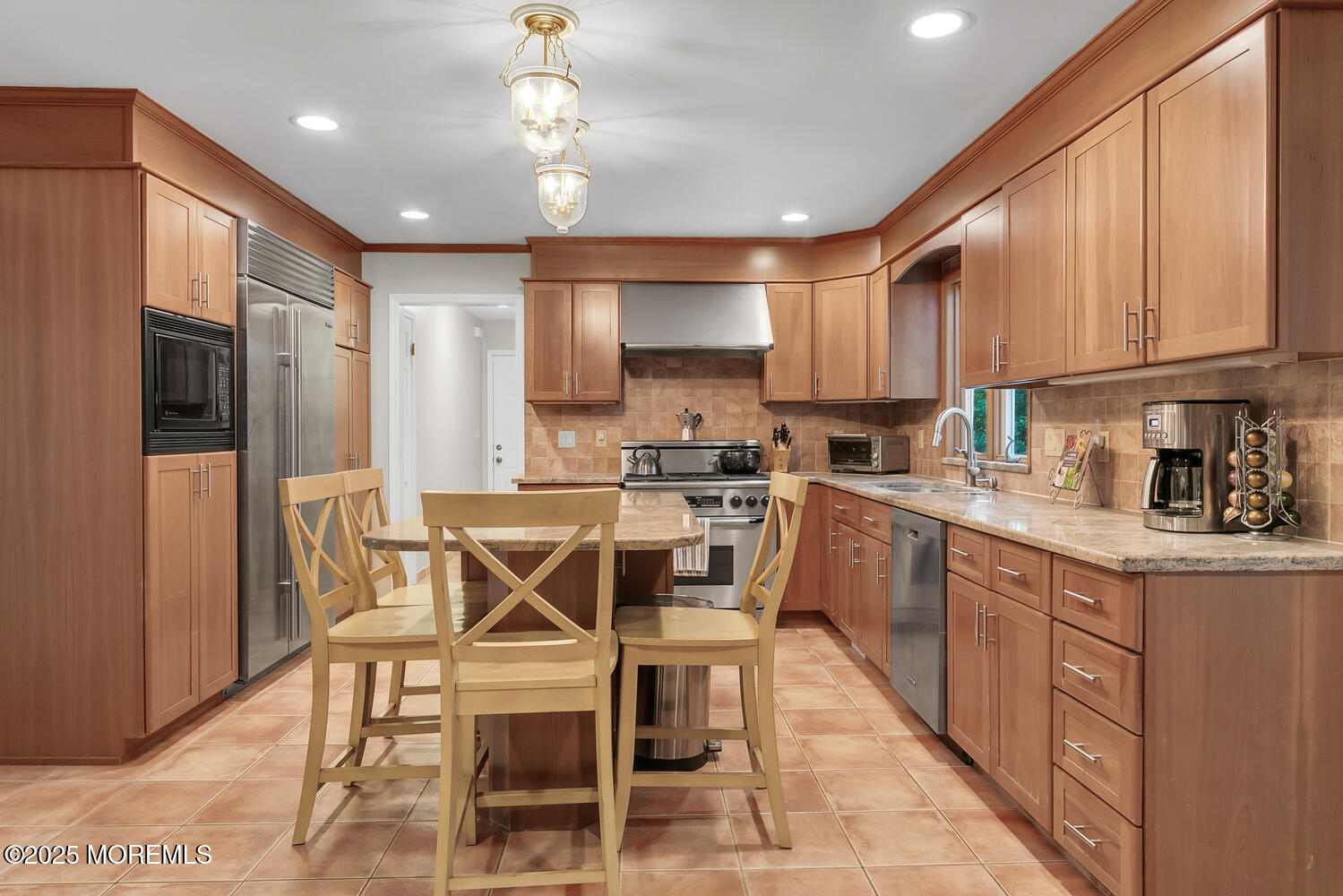 5 Page Drive Red Bank, NJ 07701 - Photo 7 of 27 a kitchen with a table chairs refrigerator and cabinets