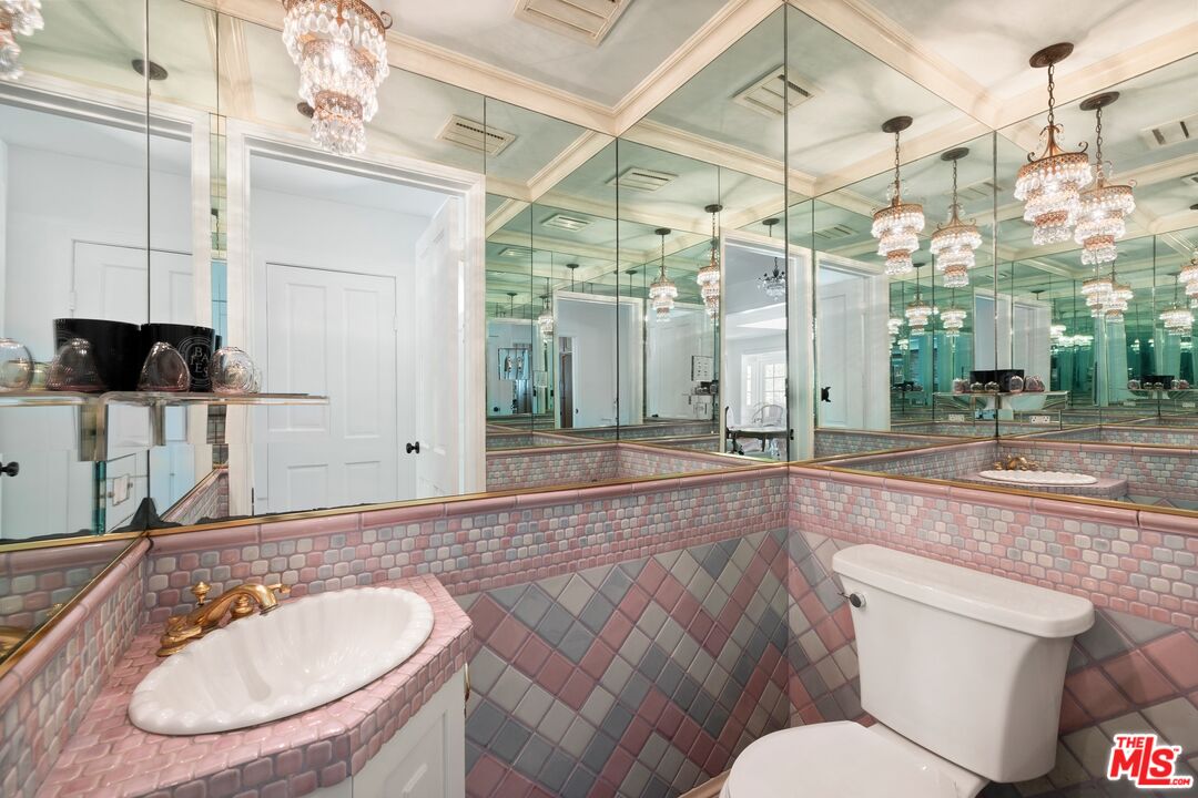 1456 Roscomare Road Los Angeles, CA 90077 - Photo 12 of 21 a bathroom with a sink a toilet and shower