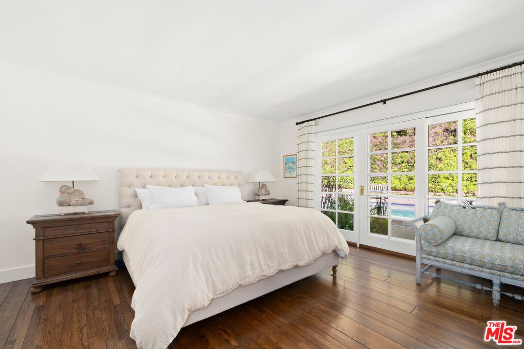 1456 Roscomare Road Los Angeles, CA 90077 - Photo 13 of 21 a bedroom with a bed and a couch