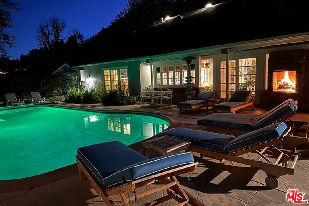 1456 Roscomare Road Los Angeles, CA 90077 - Photo 20 of 21 a living room with pool table and chairs