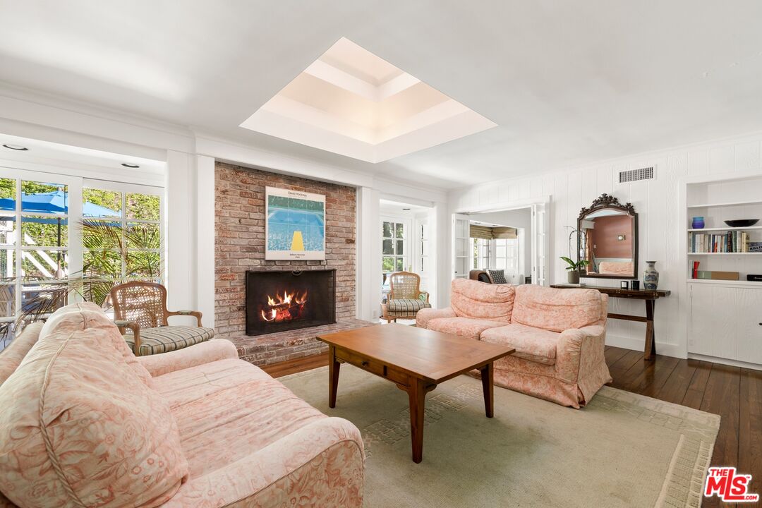 1456 Roscomare Road Los Angeles, CA 90077 - Photo 3 of 21 a bedroom with furniture and a fireplace