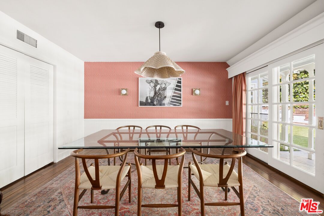 1456 Roscomare Road Los Angeles, CA 90077 - Photo 7 of 21 a view of a dining room with furniture window and wooden floor