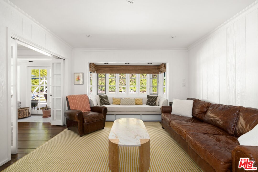 1456 Roscomare Road Los Angeles, CA 90077 - Photo 8 of 21 a living room with furniture and a large window