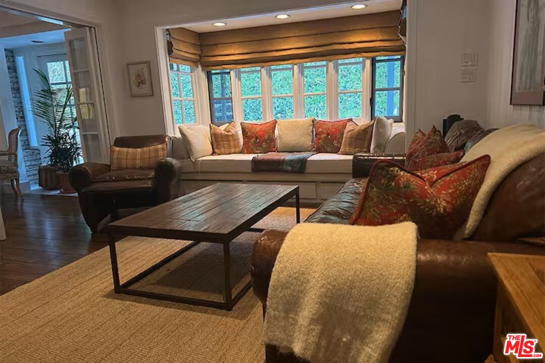 1456 Roscomare Road Los Angeles, CA 90077 - Photo 9 of 21 a living room with furniture and a large window