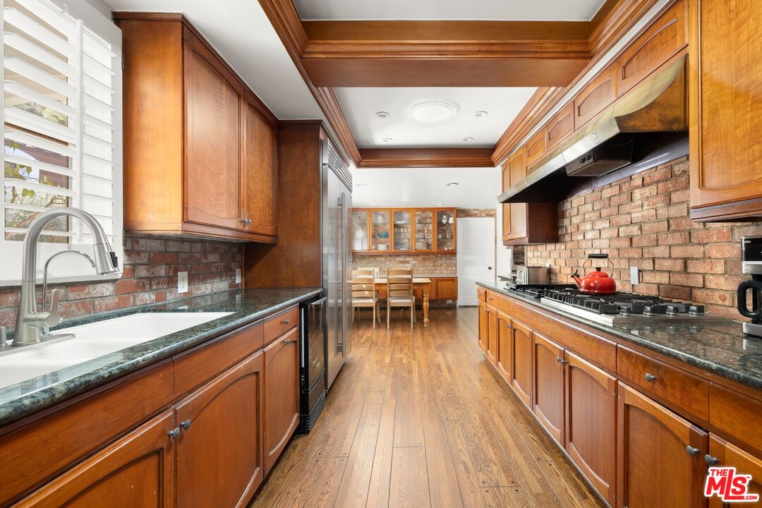 1456 Roscomare Road Los Angeles, CA 90077 - Photo 10 of 21 a kitchen with lots of counter top space and a large window