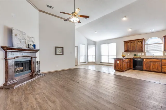 a view of kitchen with furniture and a fireplace