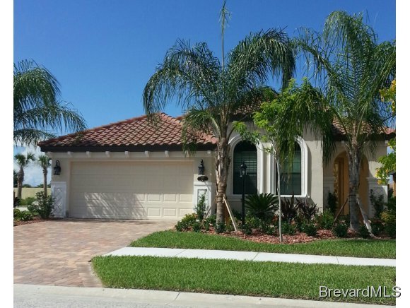 374 Point Lobos Drive Satellite Beach, FL 32937 - Photo 1 of 3 a front view of a house with a yard and garage