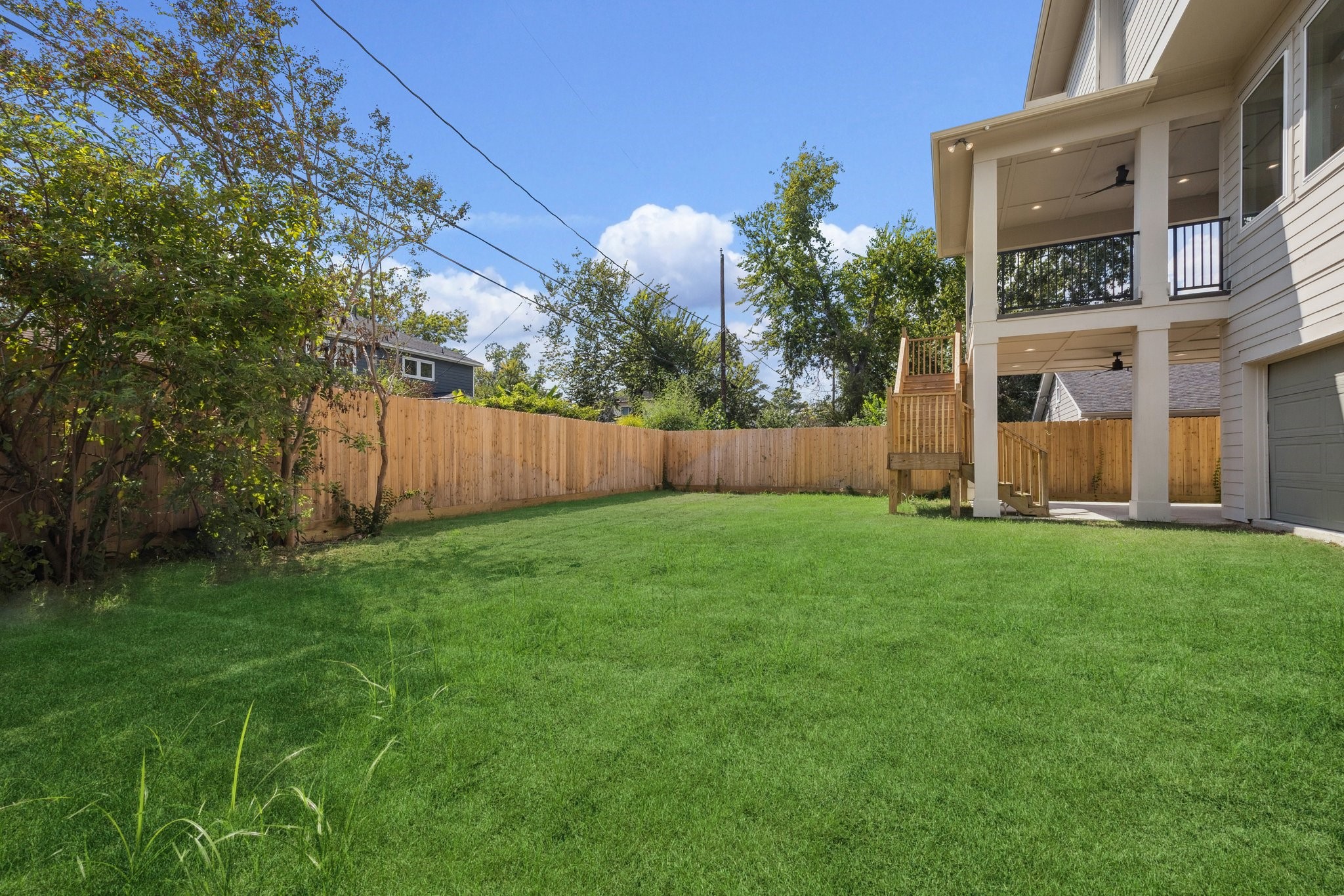 2211 Saxon Drive Houston, TX 77018 - Photo 21 of 32 a view of backyard with potted plants and a large tree