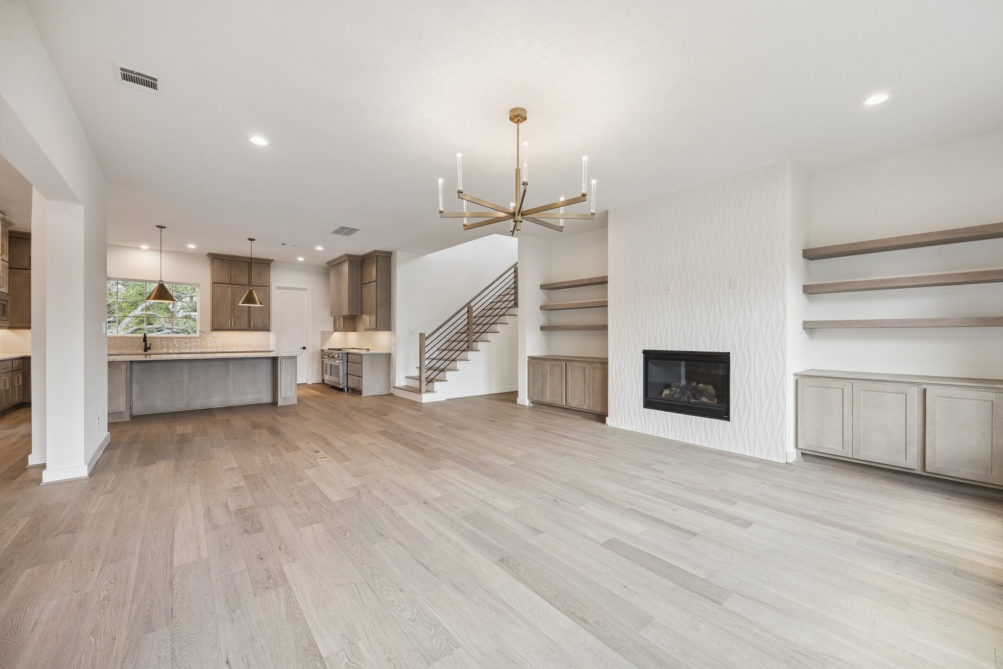 2211 Saxon Drive Houston, TX 77018 - Photo 3 of 32 a view of a kitchen with furniture and a fireplace