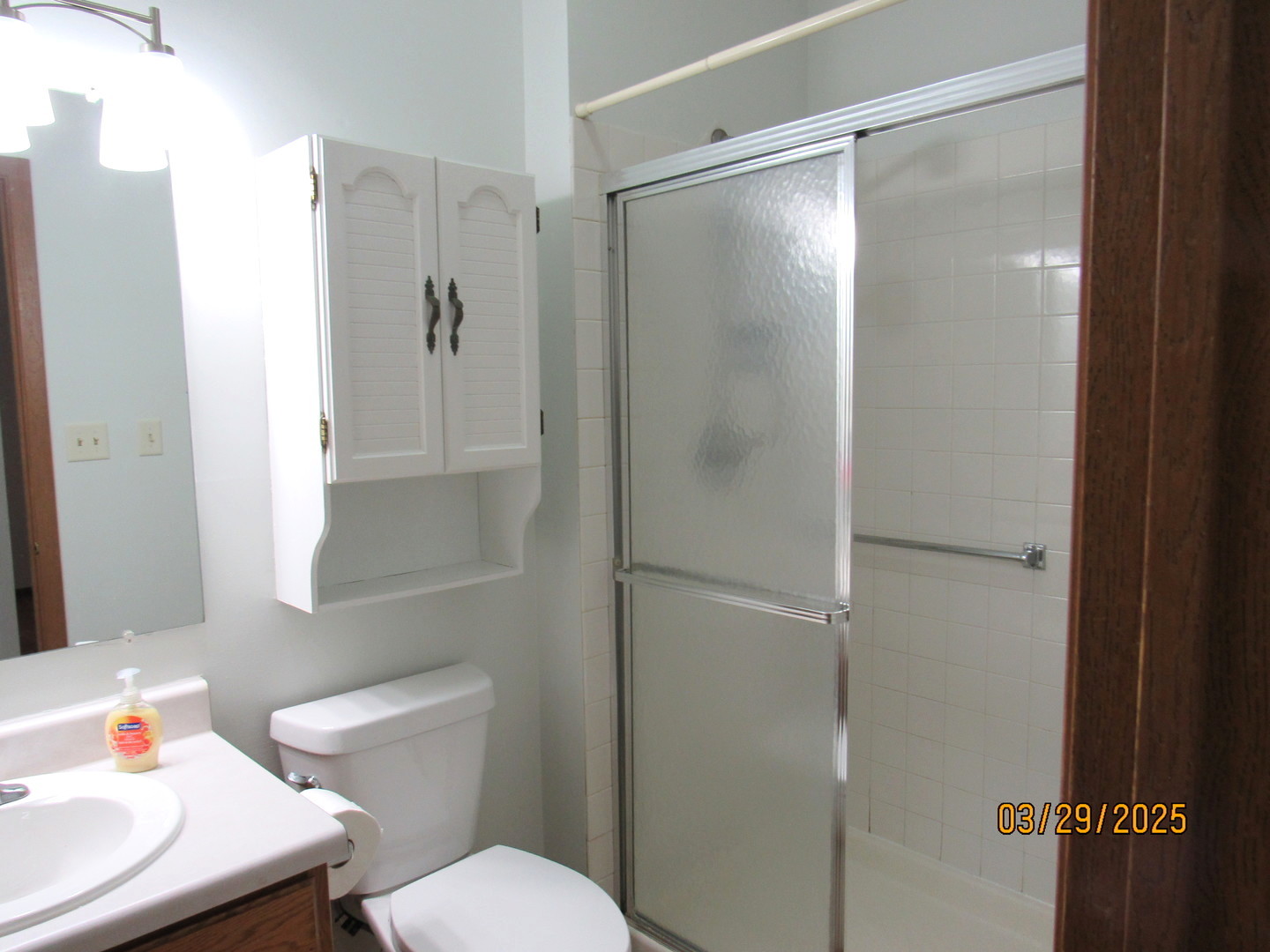 1735 Chesapeake Lane, Unit 7 Schaumburg, IL 60193 - Photo 12 of 22 a white toilet sitting next to a bathroom sink