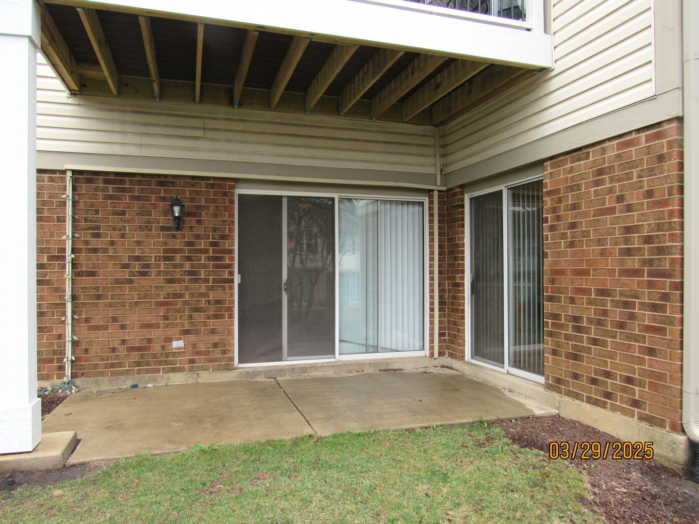 1735 Chesapeake Lane, Unit 7 Schaumburg, IL 60193 - Photo 22 of 22 a front view of a house with a yard