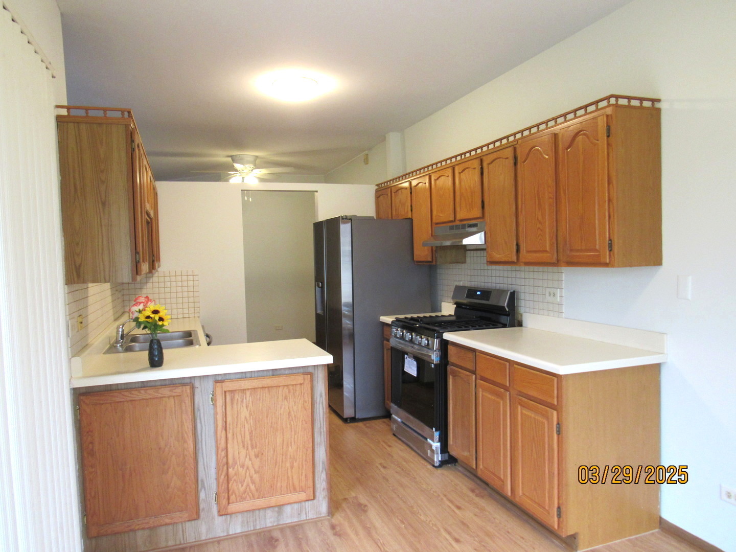 1735 Chesapeake Lane, Unit 7 Schaumburg, IL 60193 - Photo 6 of 22 a kitchen with stainless steel appliances a stove refrigerator sink and cabinets