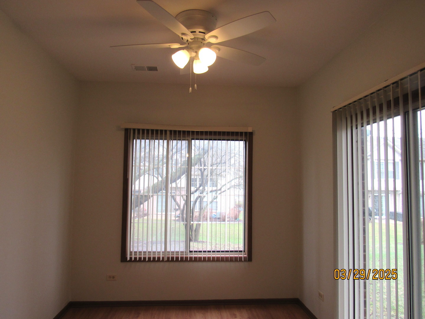 1735 Chesapeake Lane, Unit 7 Schaumburg, IL 60193 - Photo 8 of 22 a view of an empty room with a window