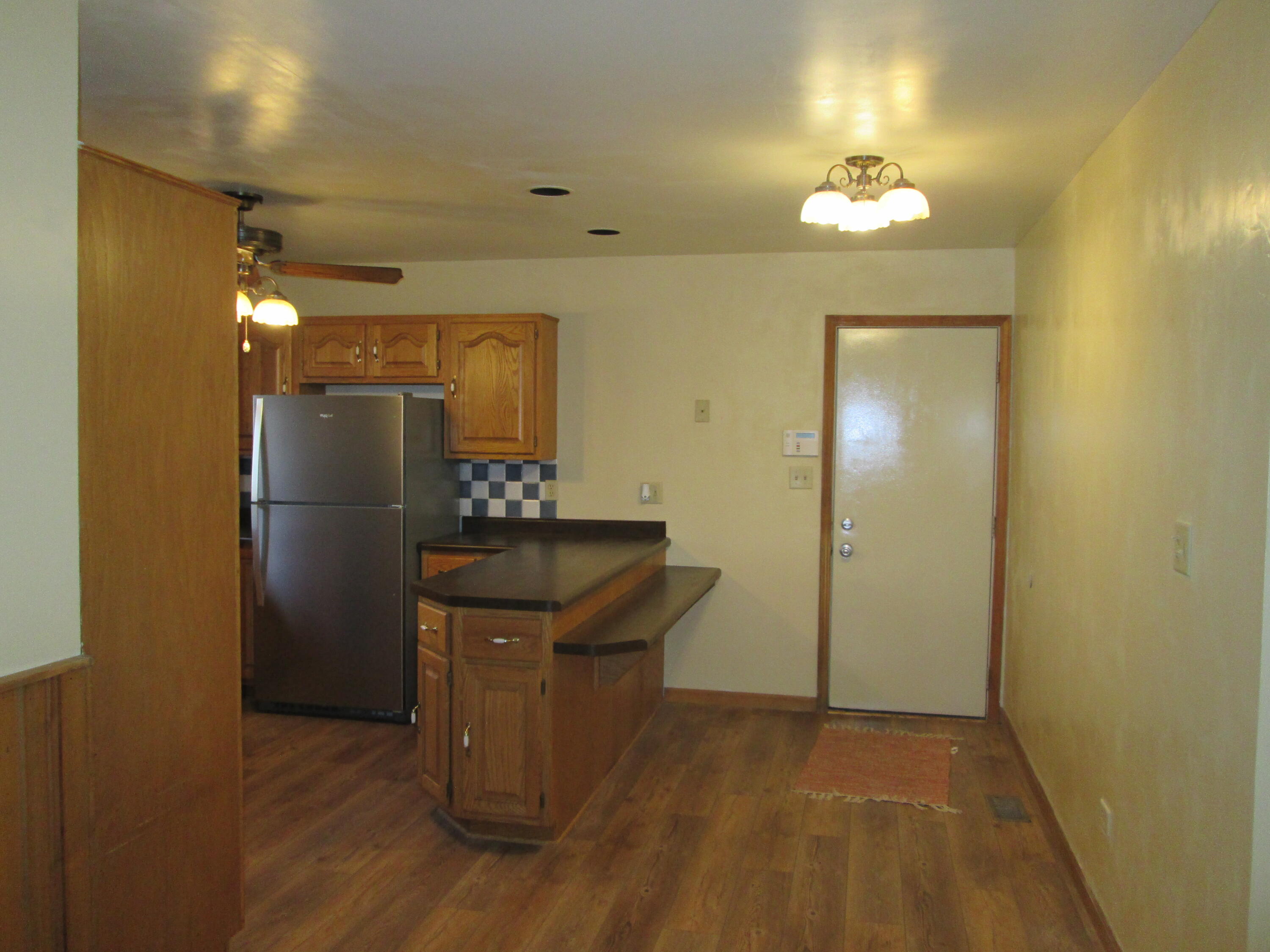 23900 Cline Avenue Lowell, IN 46356 - Photo 5 of 12 a kitchen with stainless steel appliances granite countertop a refrigerator and a sink
