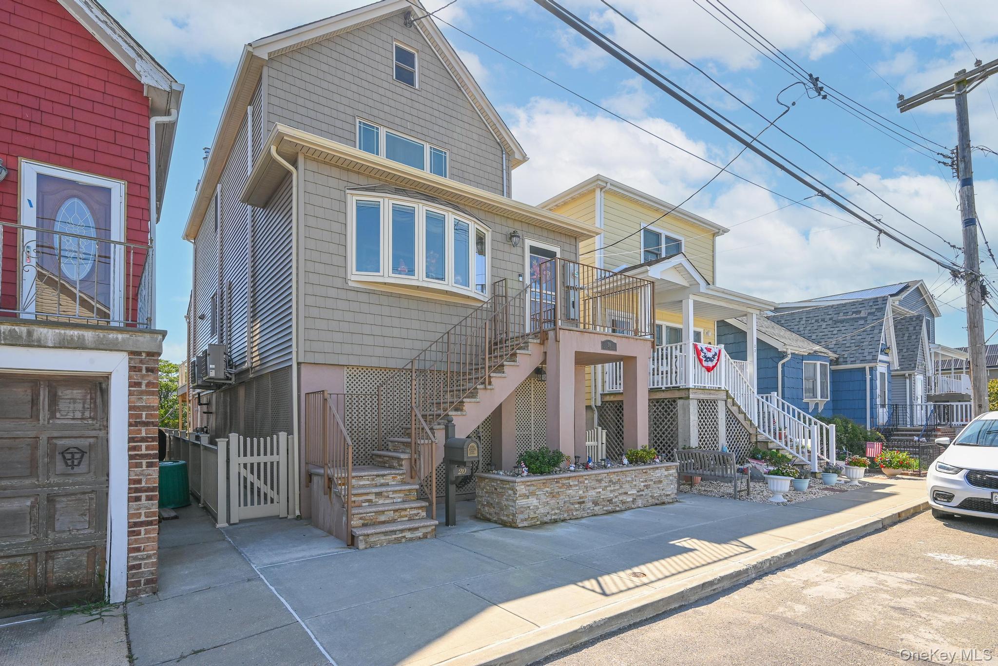 20 West 18th Road Queens, NY 11693 - Photo 2 of 41 a front view of a building with garage