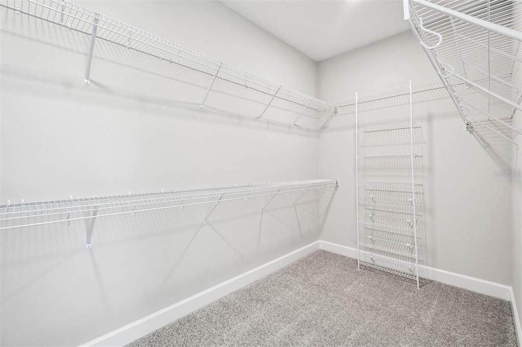 17019 Overstory Road Orlando, FL 32820 - Photo 35 of 85 a view of a room with racks on the wall
