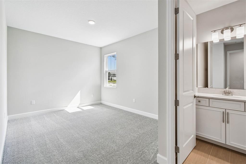 17019 Overstory Road Orlando, FL 32820 - Photo 46 of 85 a view of an empty room with a bathroom