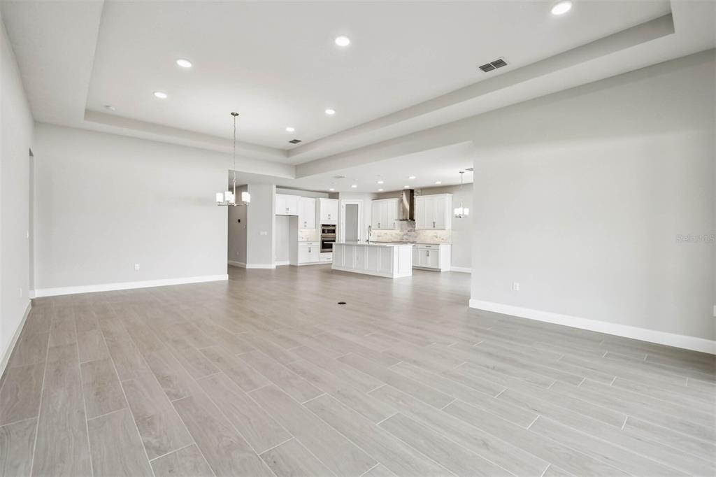 17019 Overstory Road Orlando, FL 32820 - Photo 50 of 85 a view of empty room with wooden floor