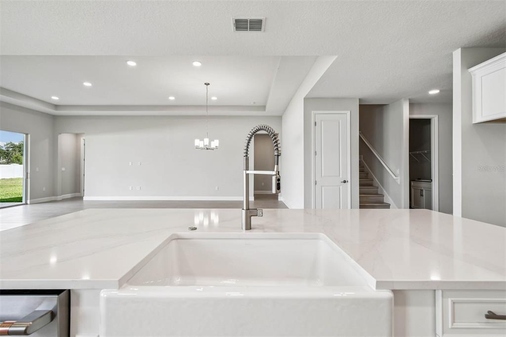 17019 Overstory Road Orlando, FL 32820 - Photo 6 of 85 a bathroom with a sink and a mirror