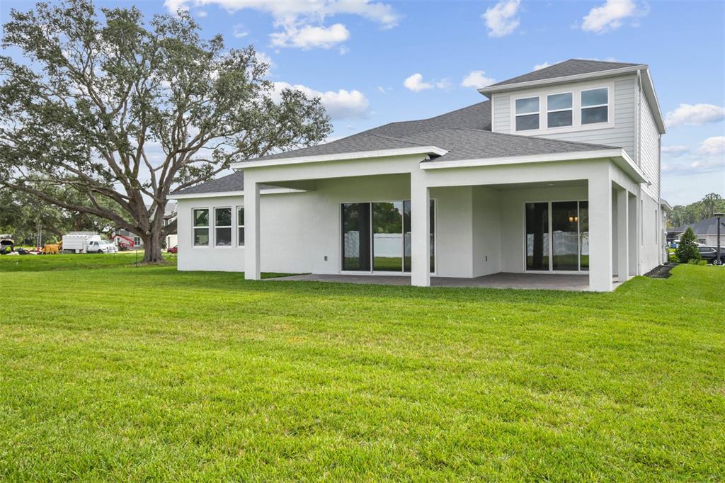 17019 Overstory Road Orlando, FL 32820 - Photo 61 of 85 a view of a house with a backyard