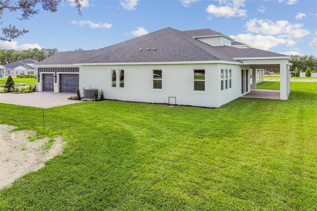 17019 Overstory Road Orlando, FL 32820 - Photo 75 of 85 a view of a house with a backyard
