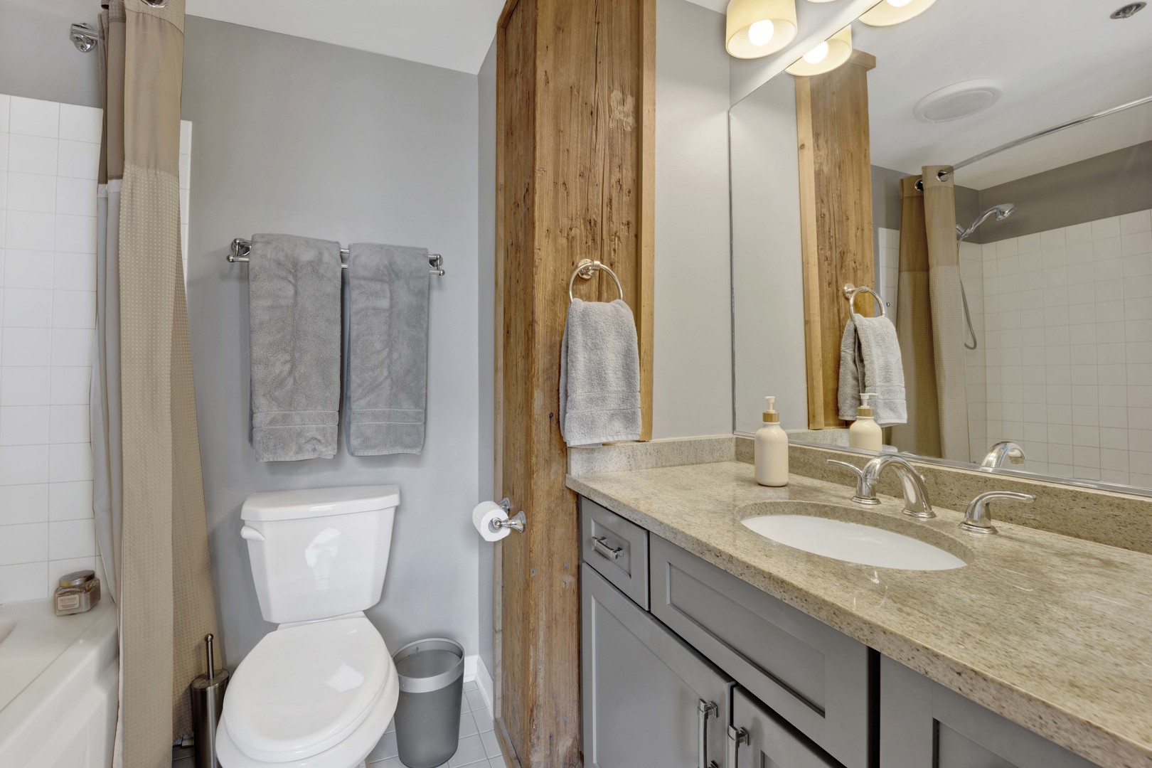 1632 South Indiana Avenue, Unit 409 Chicago, IL 60616 - Photo 12 of 21 a bathroom with a granite countertop sink toilet and shower