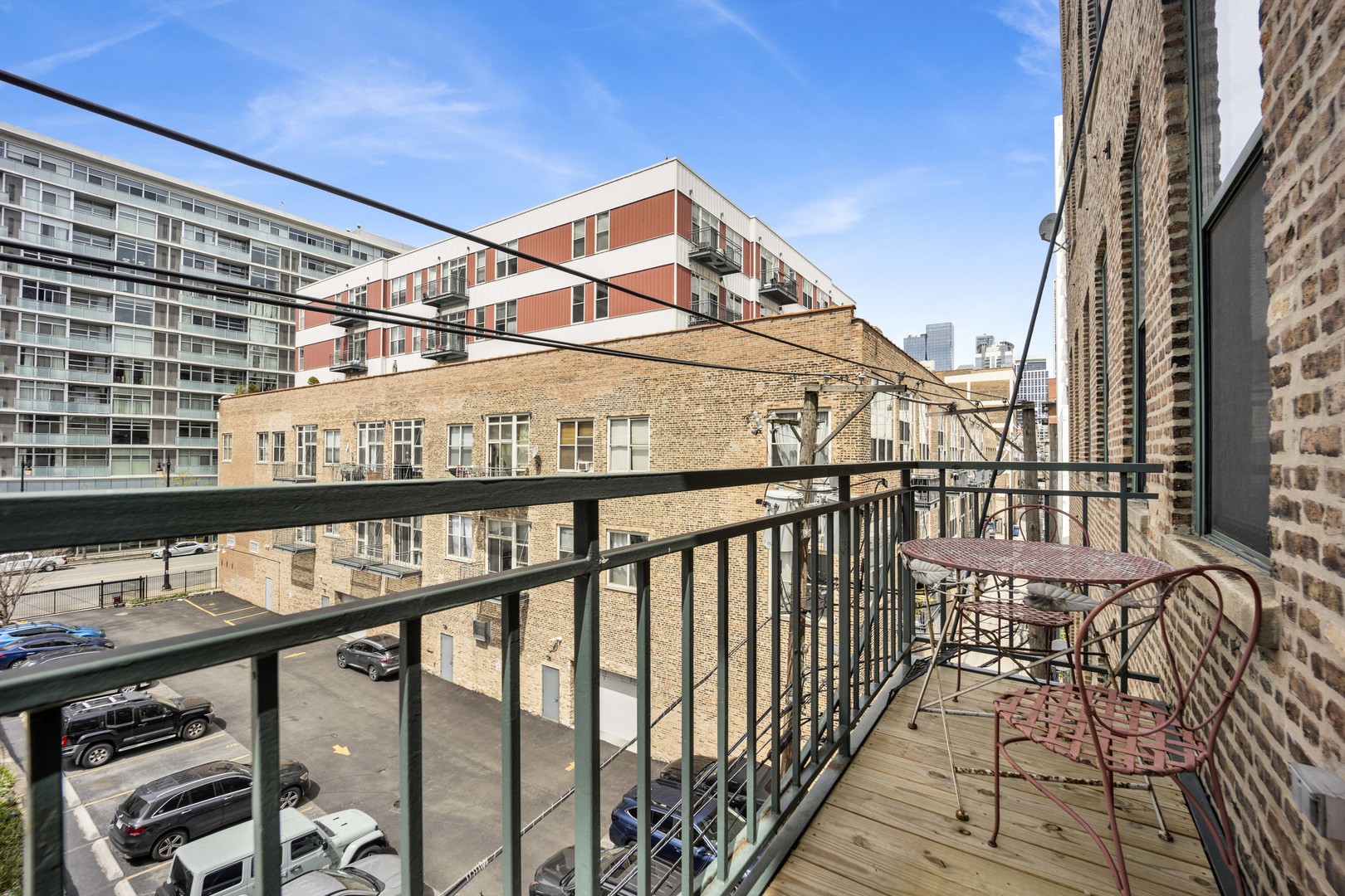 1632 South Indiana Avenue, Unit 409 Chicago, IL 60616 - Photo 16 of 21 a view of a balcony with furniture and wooden deck