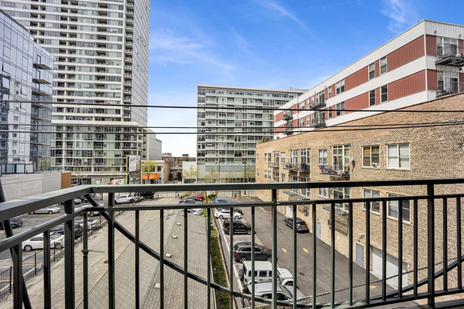 1632 South Indiana Avenue, Unit 409 Chicago, IL 60616 - Photo 17 of 21 a balcony view with a glass top table and chairs