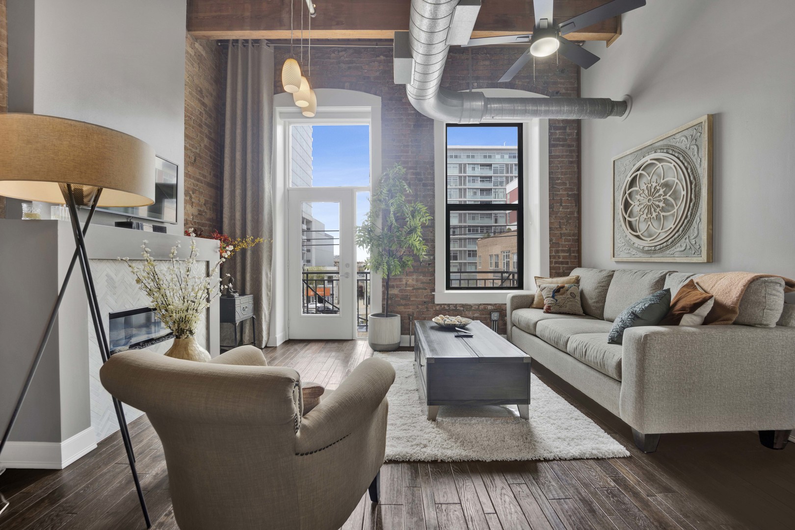 1632 South Indiana Avenue, Unit 409 Chicago, IL 60616 - Photo 2 of 21 a living room with furniture and a large window