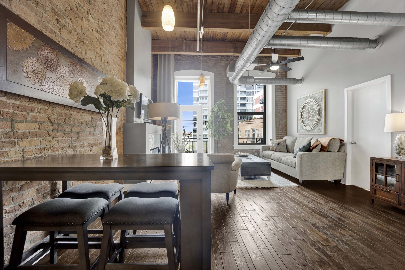 1632 South Indiana Avenue, Unit 409 Chicago, IL 60616 - Photo 6 of 21 a living room with furniture and wooden floor