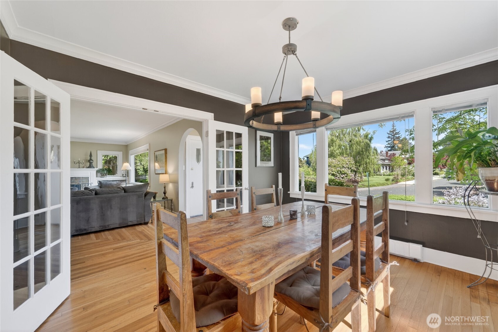 258 North Forest Street Bellingham, WA 98225 - Photo 13 of 40 a dining room with furniture a chandelier and wooden floor
