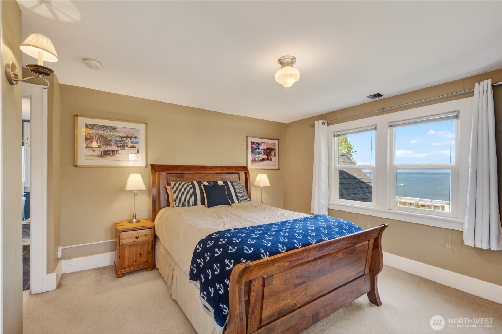 258 North Forest Street Bellingham, WA 98225 - Photo 24 of 40 a bedroom with a large bed and a large window