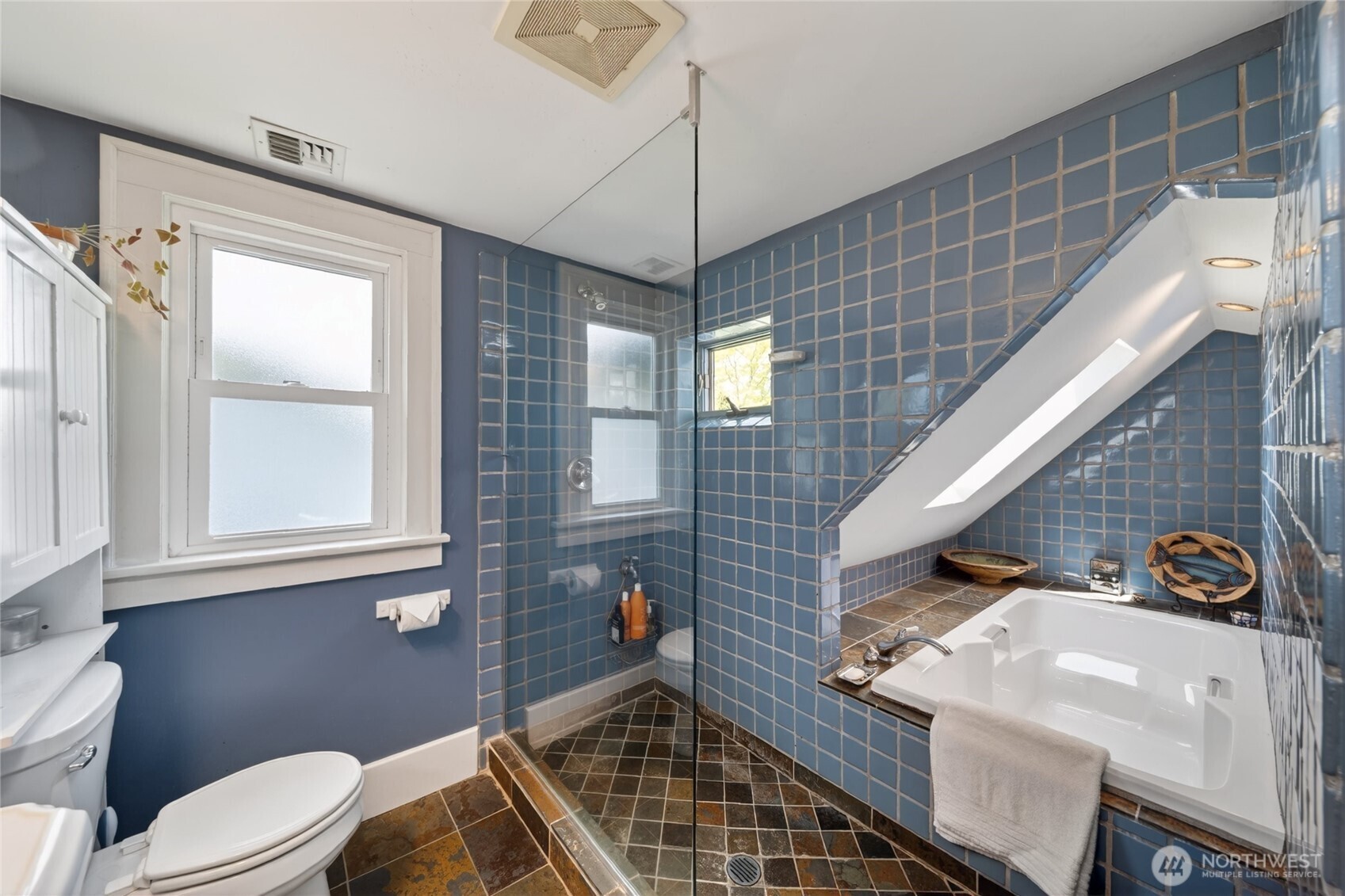 258 North Forest Street Bellingham, WA 98225 - Photo 25 of 40 a bathroom with a toilet a sink and mirror