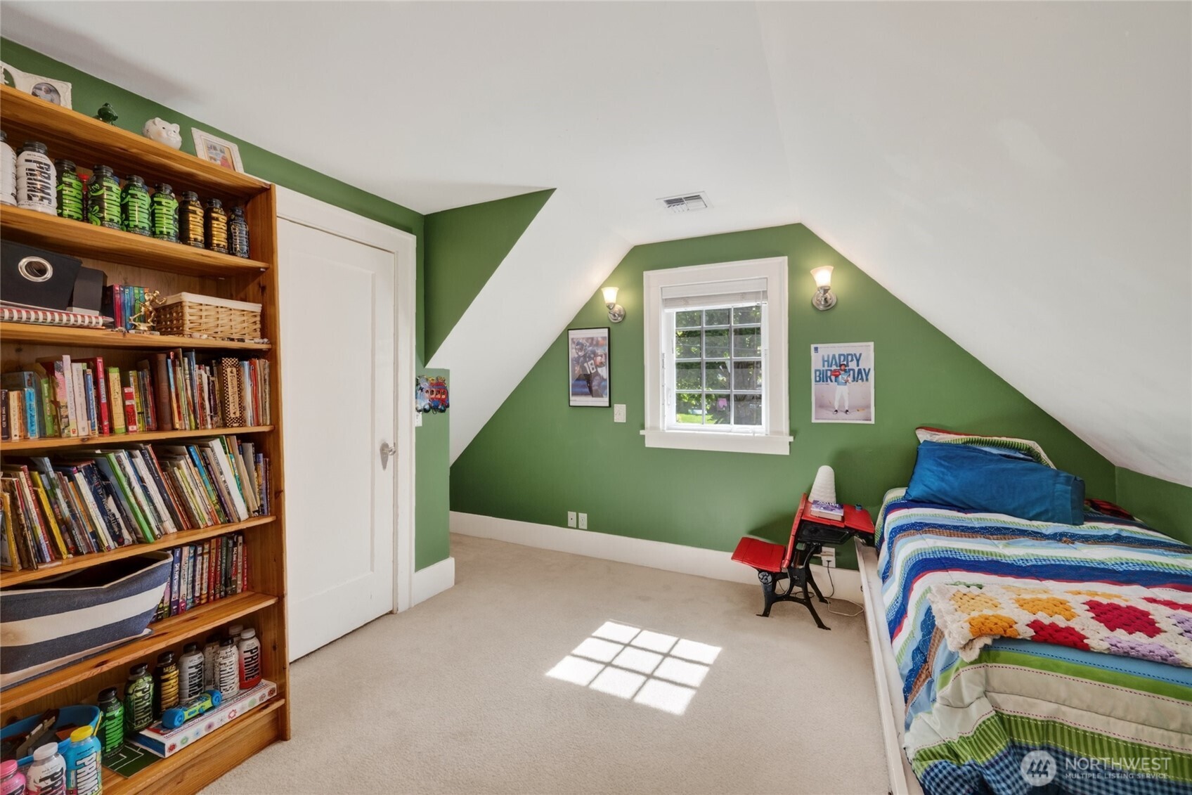258 North Forest Street Bellingham, WA 98225 - Photo 29 of 40 a bedroom with furniture and a book shelf