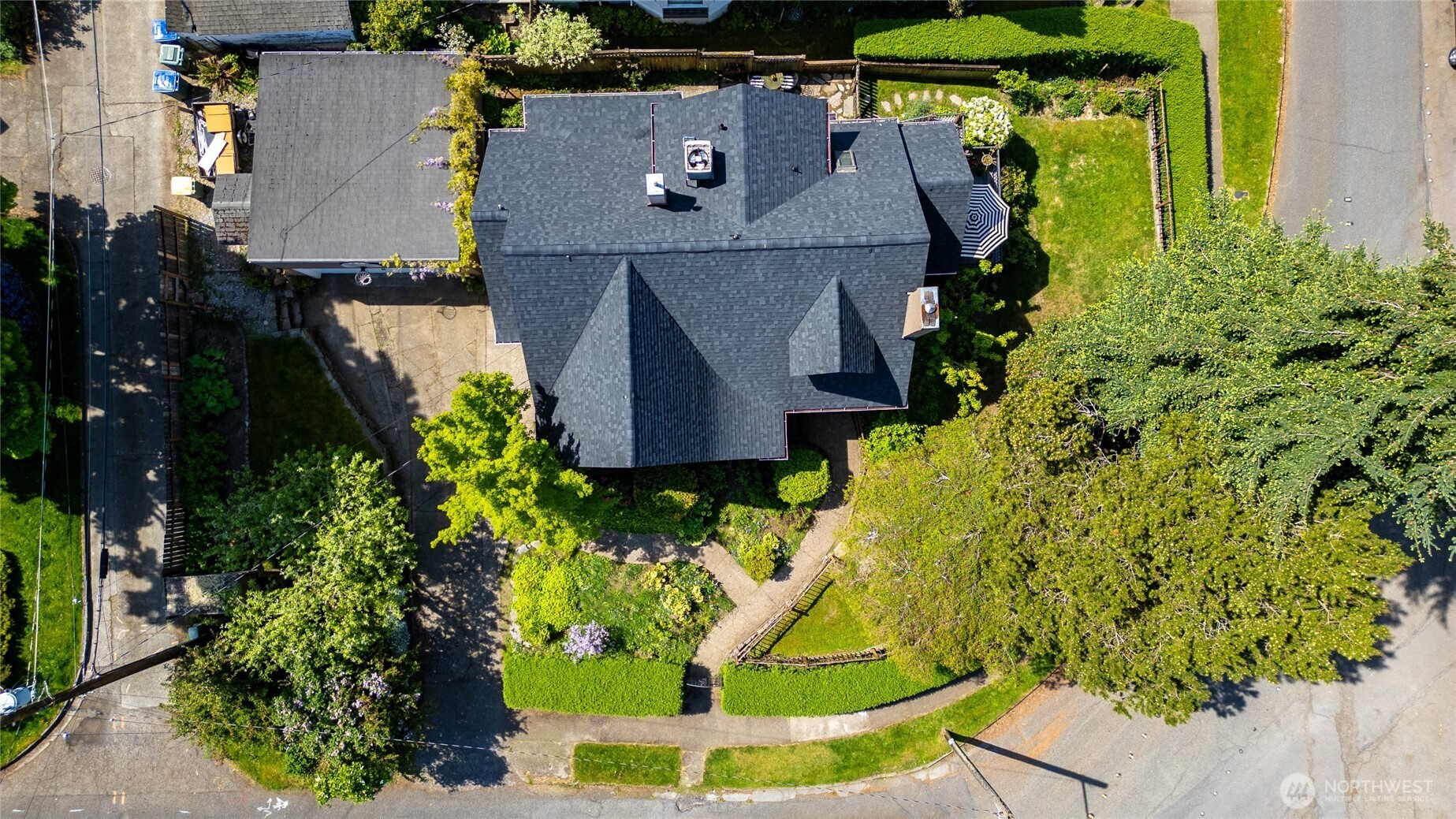 258 North Forest Street Bellingham, WA 98225 - Photo 38 of 40 an aerial view of a house with a yard and large trees