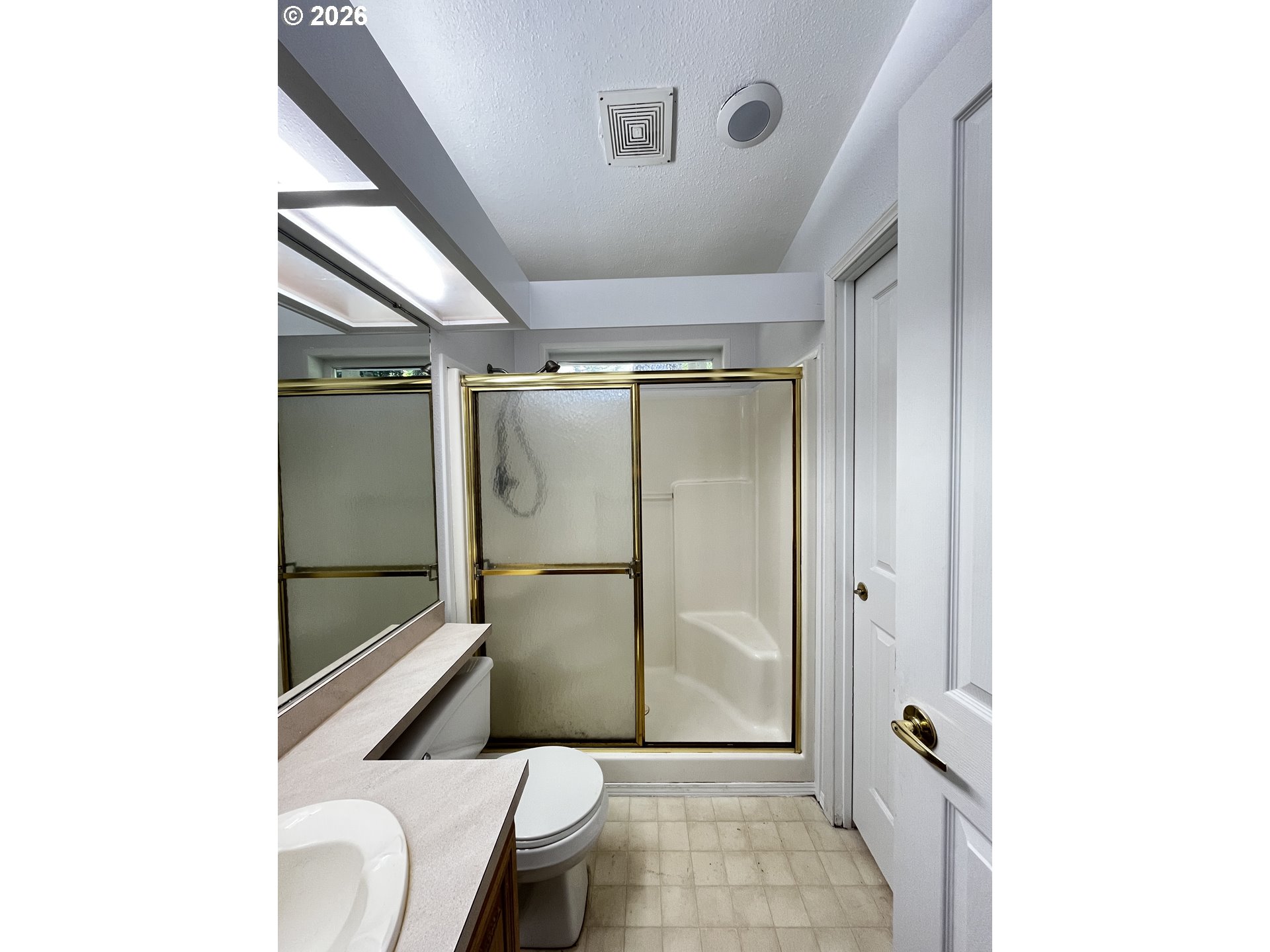 83411 Clear Lake Road Florence, OR 97439 - Photo 34 of 47 a bathroom with a granite countertop mirror and a shower