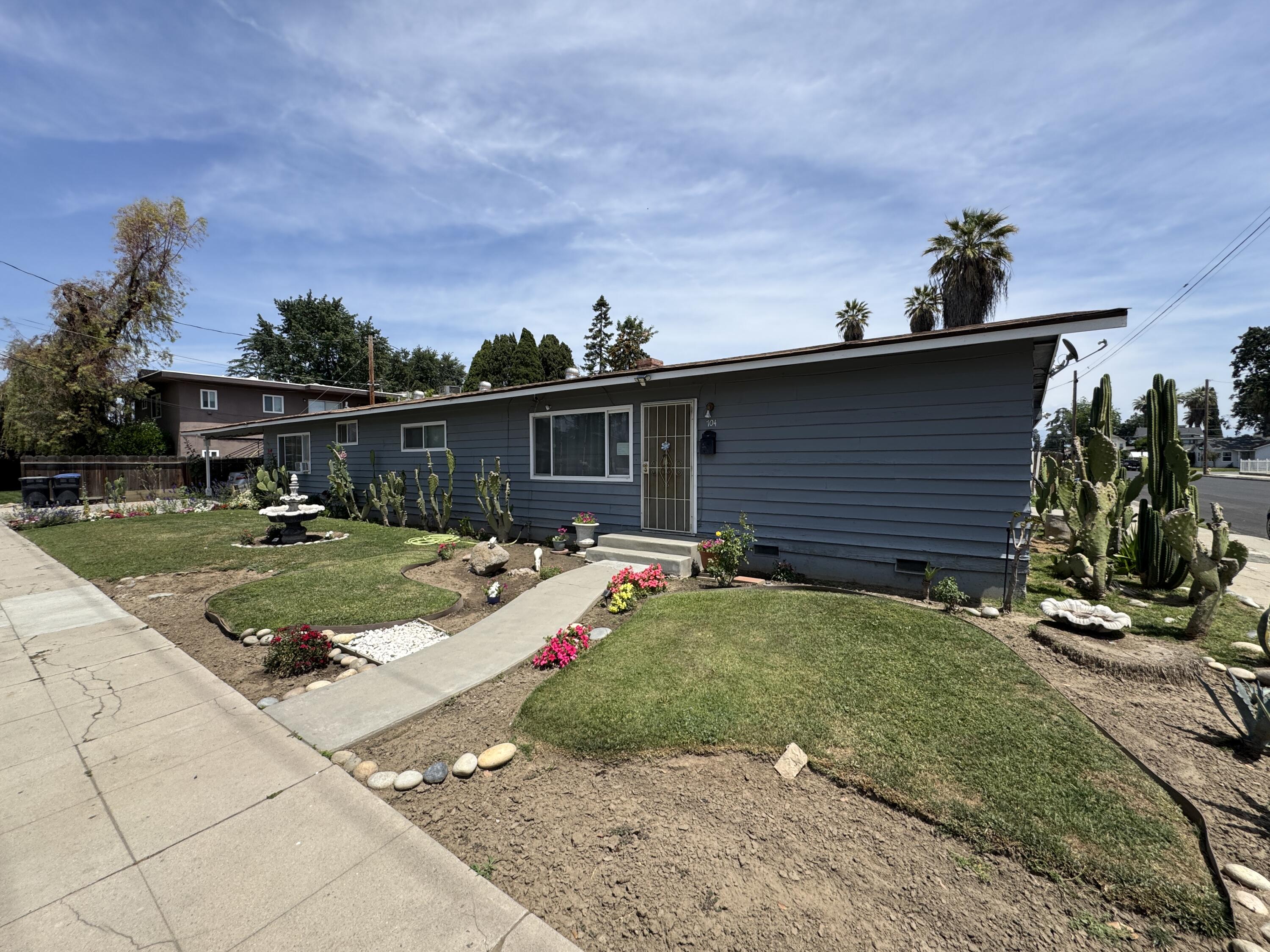 704 North Floral Street Visalia, CA 93291 - Photo 2 of 51 a view of a house with backyard