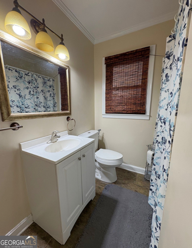 601 Linton Road South Sandersville, GA 31082 - Photo 16 of 24 a bathroom with a sink and a mirror