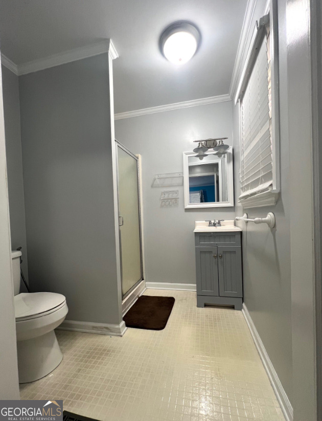 601 Linton Road South Sandersville, GA 31082 - Photo 22 of 24 a bathroom with a sink a toilet and mirror