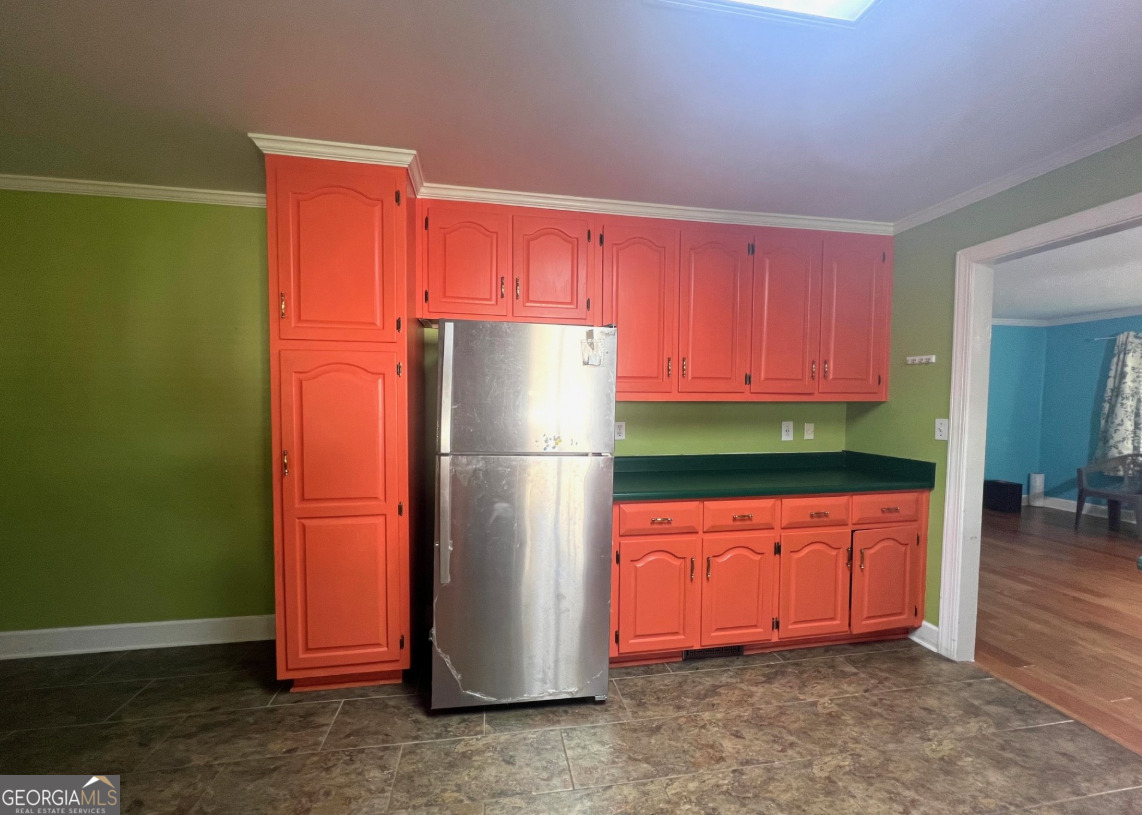 601 Linton Road South Sandersville, GA 31082 - Photo 9 of 24 a kitchen with stainless steel appliances granite countertop a refrigerator and a stove top oven