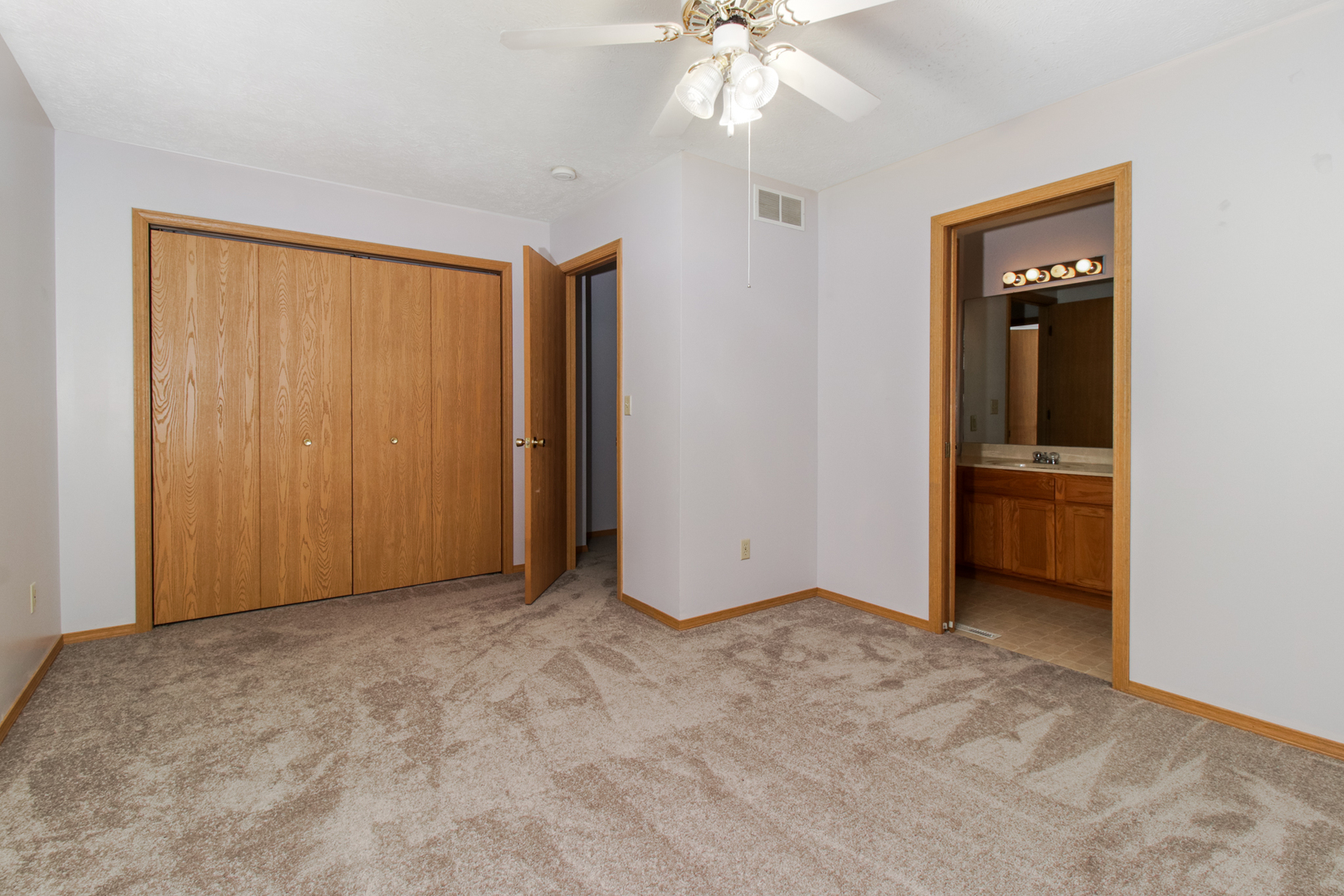 2 Andy Court, Unit 3 Bloomington, IL 61704 - Photo 13 of 28 an empty room with chandelier fan