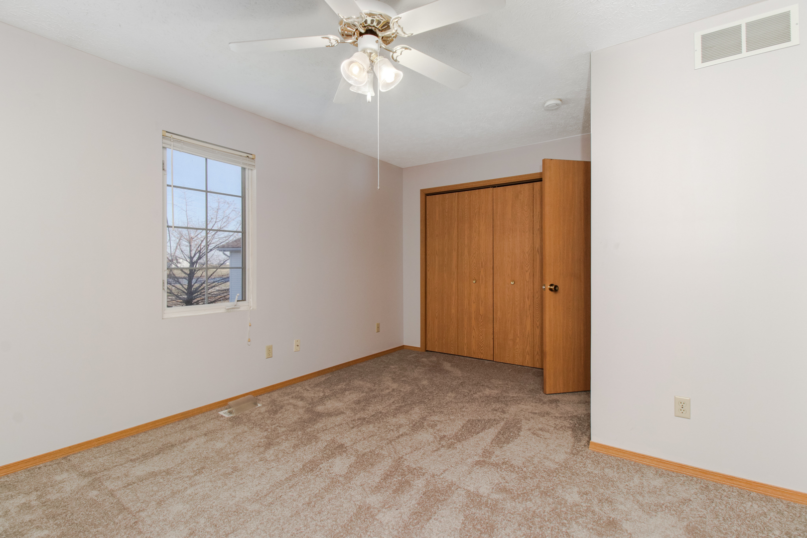 2 Andy Court, Unit 3 Bloomington, IL 61704 - Photo 14 of 28 an empty room with windows and fan