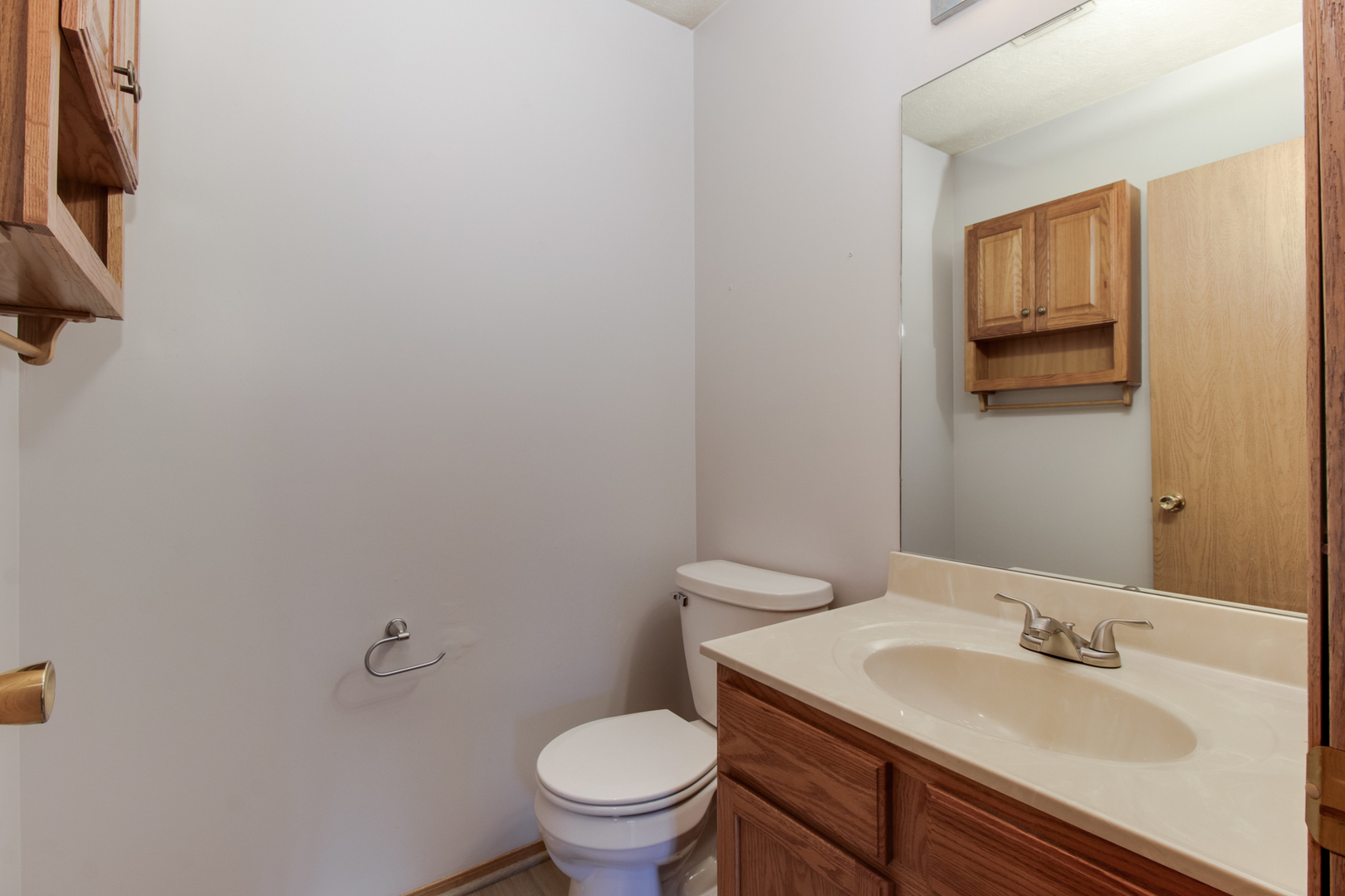 2 Andy Court, Unit 3 Bloomington, IL 61704 - Photo 23 of 28 a bathroom with a granite countertop toilet and sink