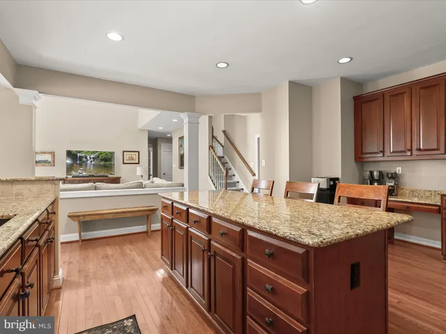 a living room with furniture a fireplace and windows