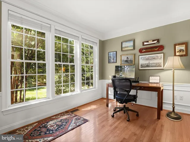 a living room with furniture a couch and a flat screen tv