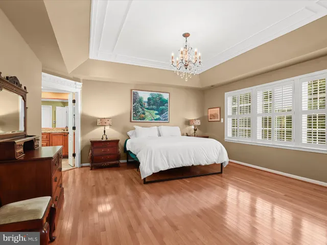 a view of a patio with couches and a table and chairs with wooden fence