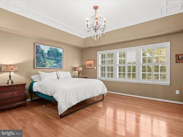 a front view of a house with a garden and porch