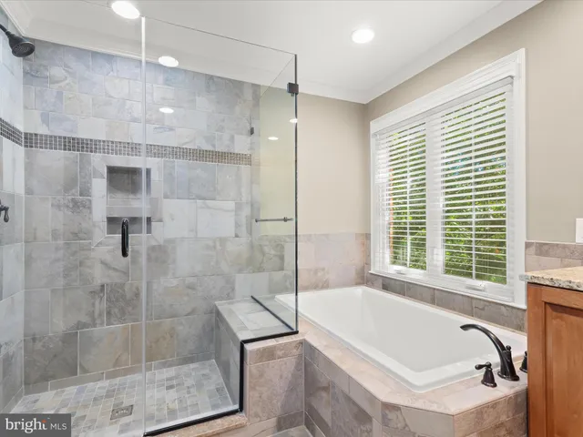 a front view of a house with a garden and plants