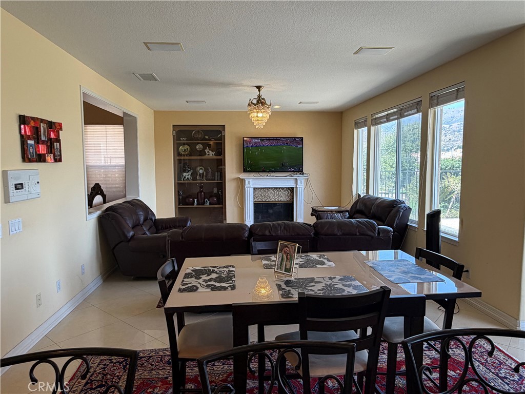 19823 Mariposa Pines Way Porter Ranch, CA 91326 - Photo 23 of 50 a view of a dining room with furniture window and outside view