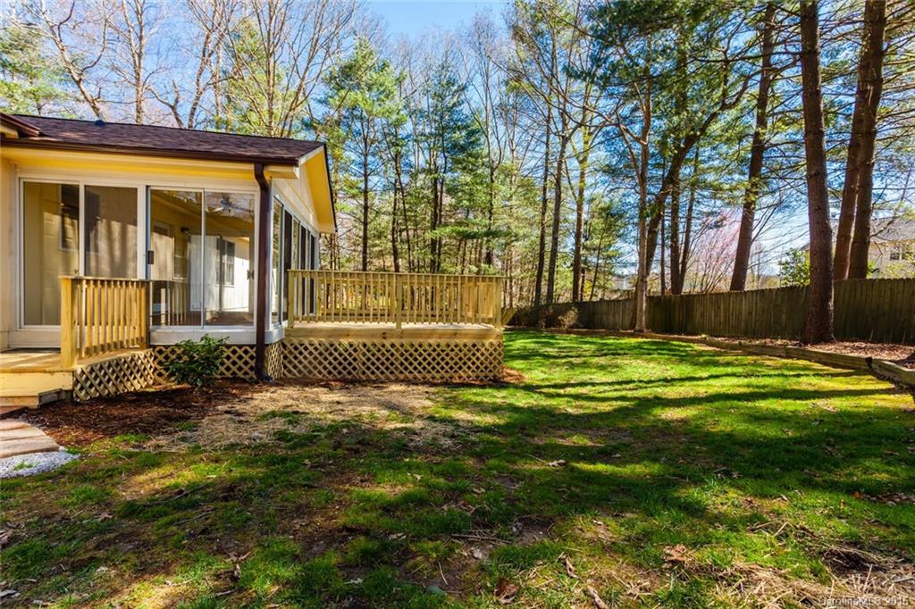 38 Westfield Road Fletcher, NC 28732 - Photo 22 of 24 a view of a house with a big yard and large trees